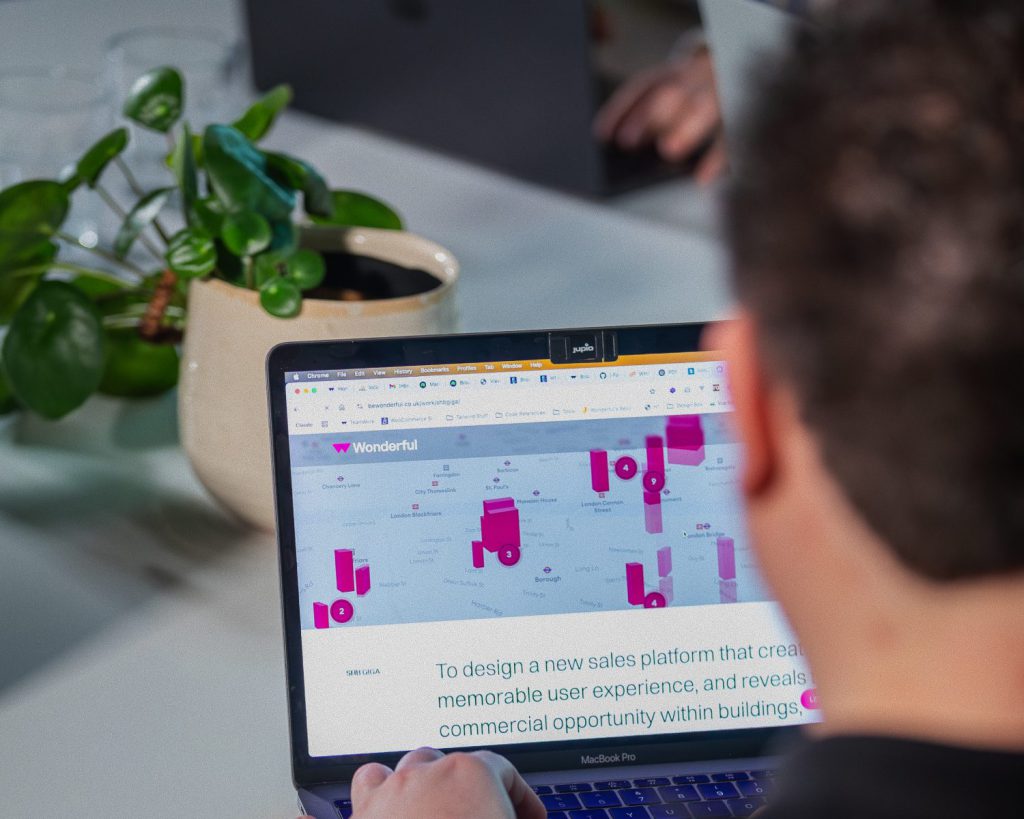 A Wonderful designer reviewing a client sales platform